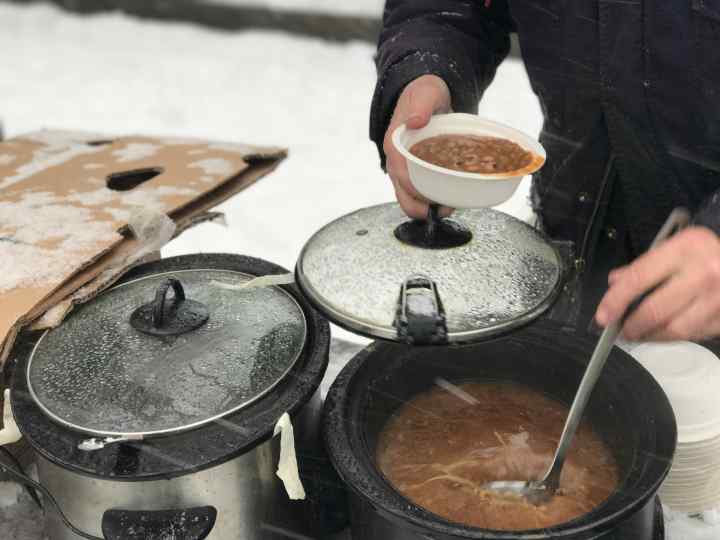 Gordon Fitch serving soup during a blizzard at the Community Solidarity Bedstuy Brooklyn Food Share 