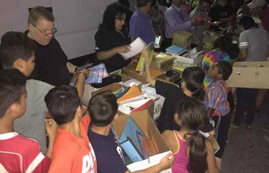 Community Solidarity shares free School Supplies with local children.