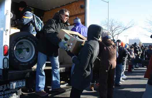 Unloading trucks of donations at the Community Solidarity Hempstead Food Share