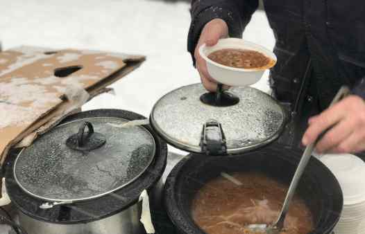 Gordon Fitch serving soup during a blizzard at the Community Solidarity Bedstuy Brooklyn Food Share 