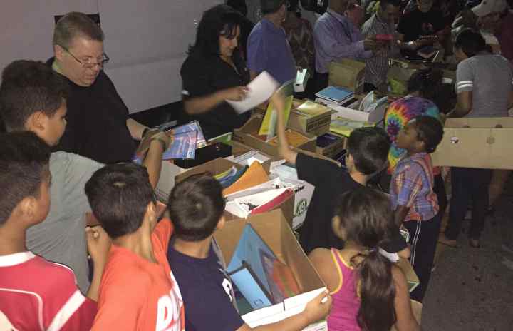 Community Solidarity shares free School Supplies with local children.