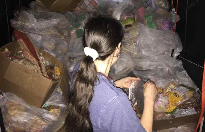 Haylee loading the Community Solidarity Van