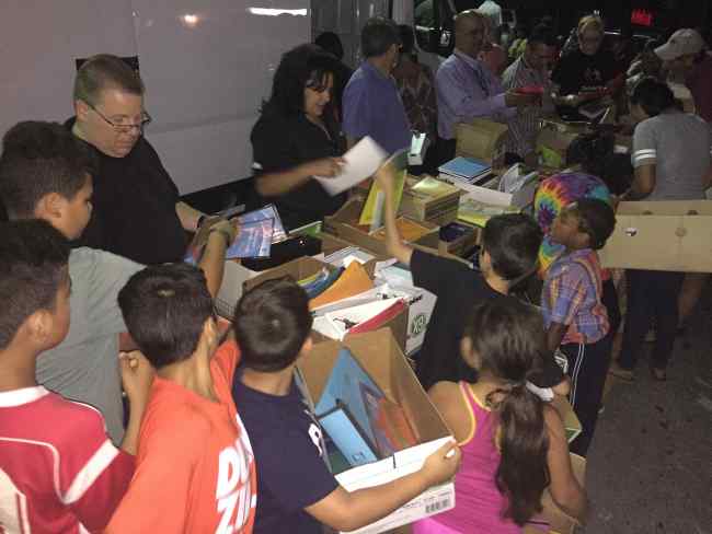 Community Solidarity shares free School Supplies with local children.